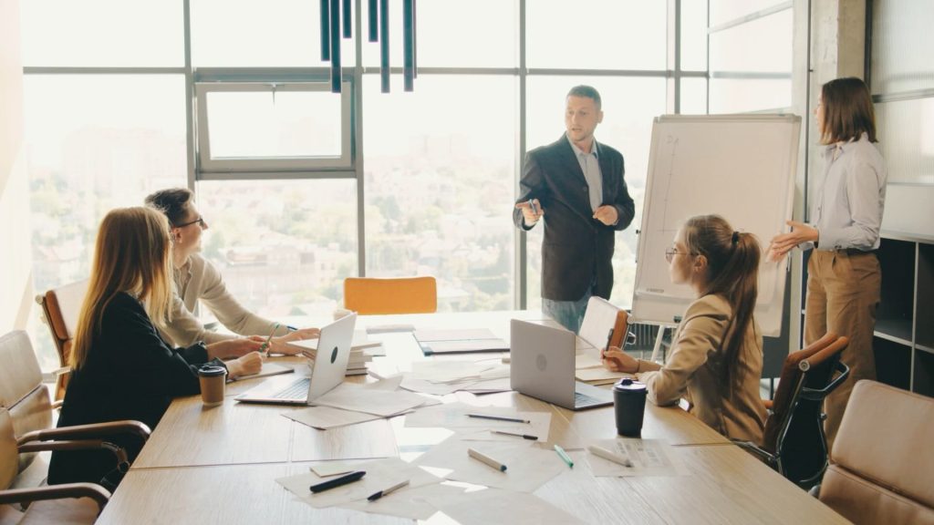 Fractional CFO Category - People meeting in a sunny boardroom