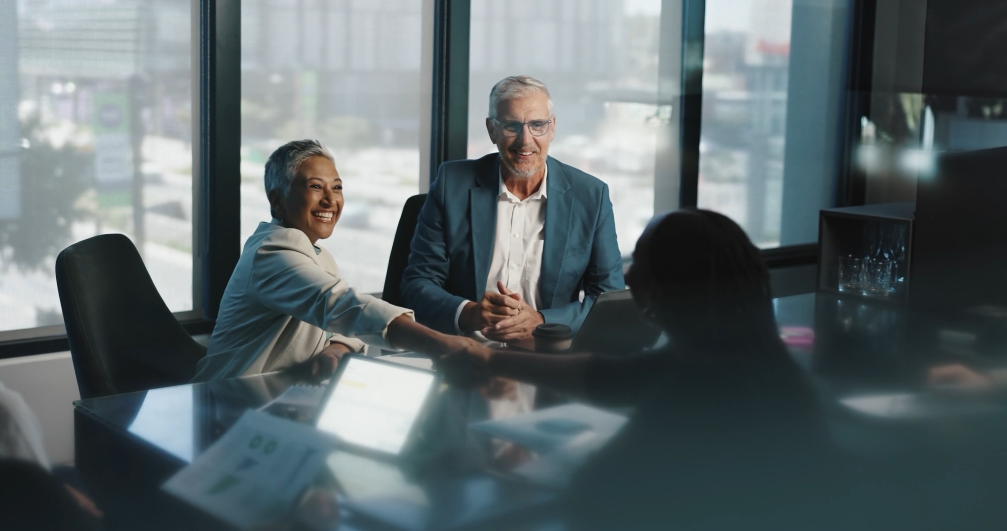 Outsourced Accounting Category - A pair of business people shaking hands with a client
